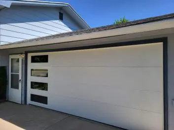 After of updated white 2 car garage with windows on side
