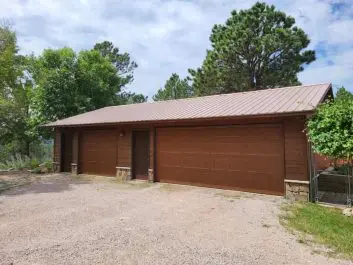 After of updated brown 2 door 3 car garage