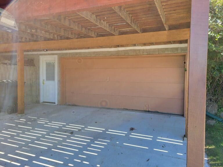 Before of old tan colored 2 car garage