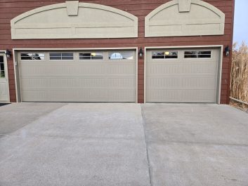 New residential garage doors with horizontal windows in top panel
