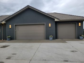 before of a double car garage door and a single car garage door on a house