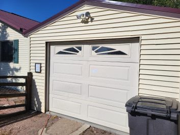 After of cream 1 car garage with windows