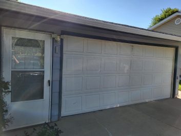 Before of dated white 2 car garage