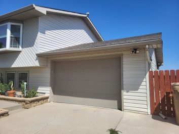 Before of dated taupe colored 1.5 car garage