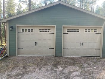 Before of cream colored 2 door 2 car garage