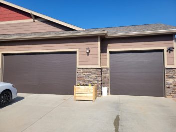 Brown residential home with updated door - After