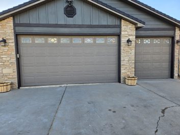 old and dated residential garage doors on a home in Rapid City, SD